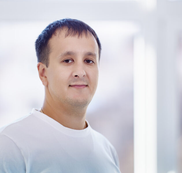 Portrait of mixed race man 38 years old with brown hair indoors.