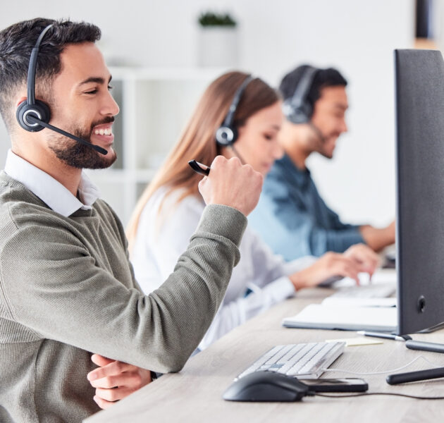 Man, call center and working in team office with headset, computer for online customer support,