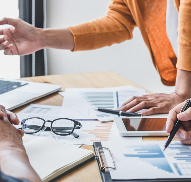 Business team collaboration discussing working analyzing with financial data and marketing growth report graph in team, presentation and brainstorming to strategy planning making profit of company.